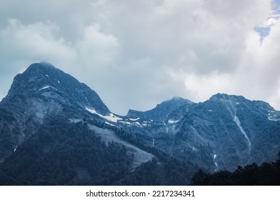 Mountain Landscape. Snowy Peak. Fog And Aerial Perspective.