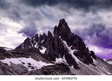 Mountain landscape with storm clouds in Sexten Dolomites. Mount Paternkofel in South Tyrol, Italy. - Powered by Shutterstock