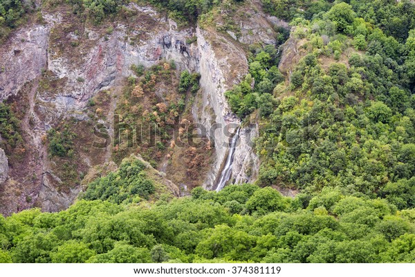 Mountain landscape waterfall flows down the cliff. The
landscape in Armenia (Tatev). The canyon next to the cable car
