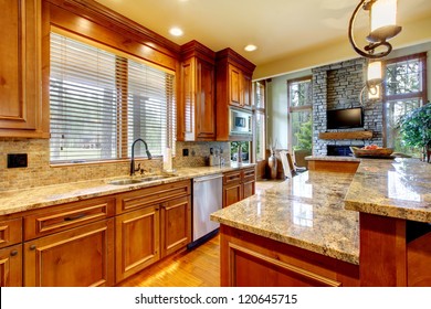 Mountain Luxury Home With Wood Kitchen And Granite Countertop.