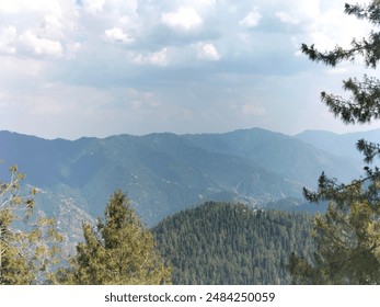 "Mountain Majestic Beauty: A breathtaking view of towering, snow-capped peaks under a clear blue sky, with rugged terrain and lush greenery in the foreground. Ideal for nature, travel, and adventure . - Powered by Shutterstock