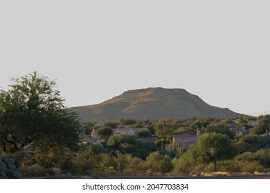 Mountain Mesa With A Foreground Of Desert Plant Life.