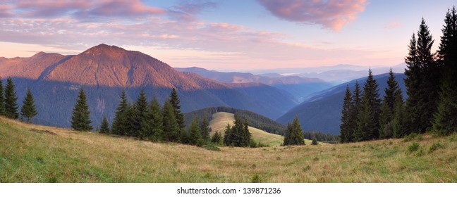 Mountain panorama with a beautiful morning. Mountain landscape with pine forest - Shutterstock ID 139871236