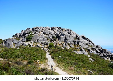 Mountain path leading to large rocks in the Monchique mountains, Foia, Algarve, Portugal, Europe.