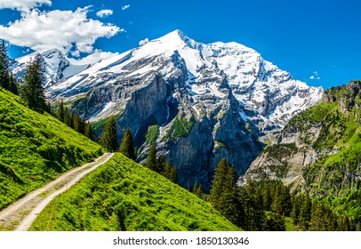 Mountain Path To Snow Topped Peak Landscape