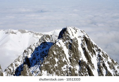 mountain peak with clouds in the background