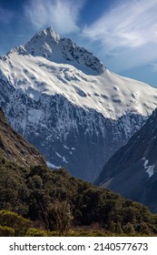 Mountain Peak in Fiordland National Park on the Way to Milford Sound New Zealand Covered In Snow on Bright Spring Day