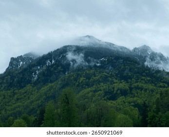 Mountain Peak Obscured by Clouds and Fog