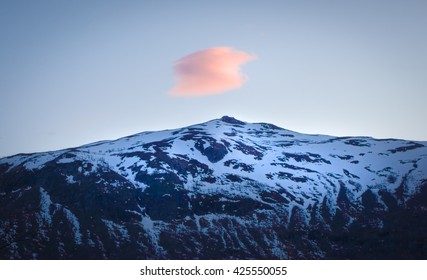 Mountain peak with Red Cloud