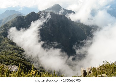 Mountain Peak Through The Clouds