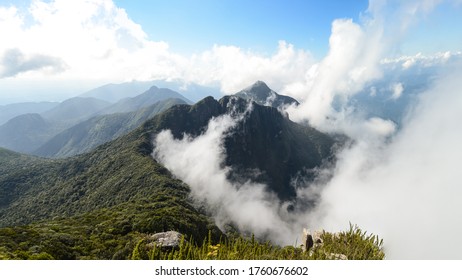 Mountain Peak Through The Clouds