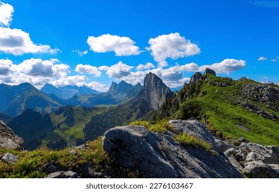 Mountain peak under clouds and blue sky. Beautiful mountain landscape. Summer day in mountains. Mountain sky clouds landscape