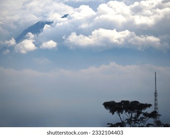 Mountain peaks covered with clouds