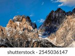 Mountain peaks on blue sky background. Mountain peaks. Mountain sky peaks. Mountain rocks