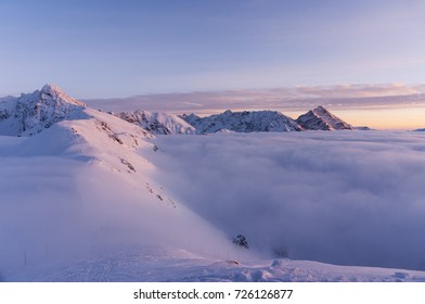 Mountain peaks in the setting sun during inversion. Tatra Mountains.