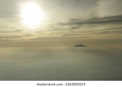 Mountain Peeks Out The Clouds