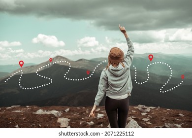 Mountain Progression Path. Traveling Caucasian Female Traveler Explorer Stands On The Top Of The Mountain And Enjoys The View Of The Mountains.