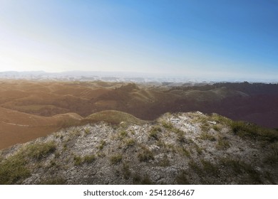 Mountain range with blue sky and clouds in the background. The sky is clear. Horizon sky landscape and sky view background