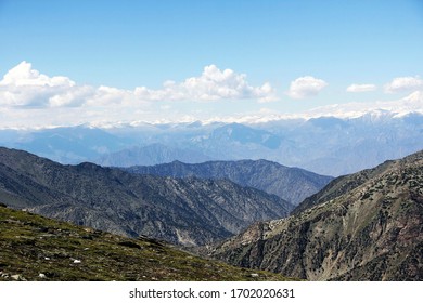 Mountain range and clouds on the blue sky