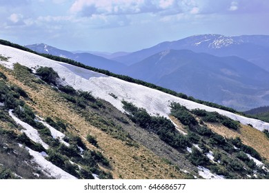 mountain range covered with snow
