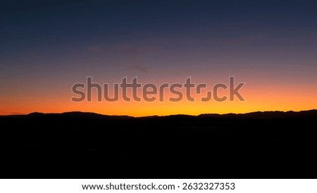 A mountain range at dusk as I was driving down from Central Otago to Dunedin, New Zealand.  This would make a very nice print.