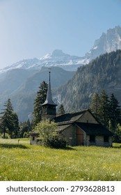 Snow‑Covered Mountain Range with Forest Foreground
