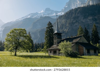 Snow‑Covered Mountain Range with Forest Foreground