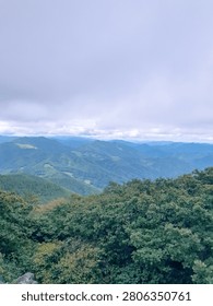 Mountain Range Forest Valley Under Cloudy Sky