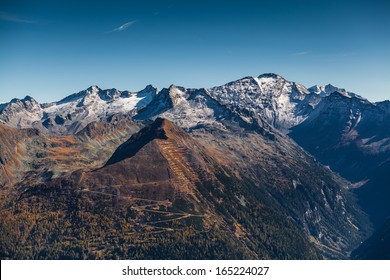 Mountain range with glaciers and blue sky in fall