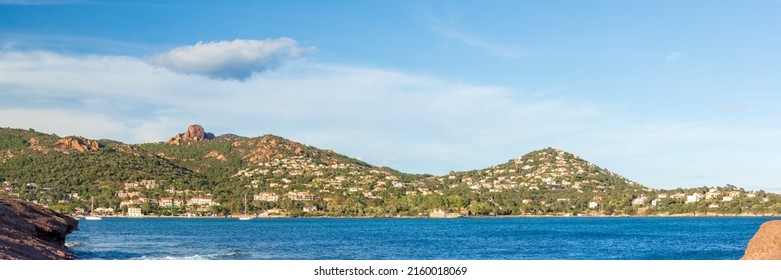 mountain range with lone cloud in the blue sky on the on the French Riviera coast - Shutterstock ID 2160018069