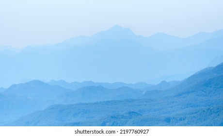 Mountain Range Silhouette In A Blue Haze