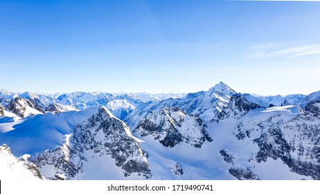 Mountain Range With Snow And A Blue Sky 