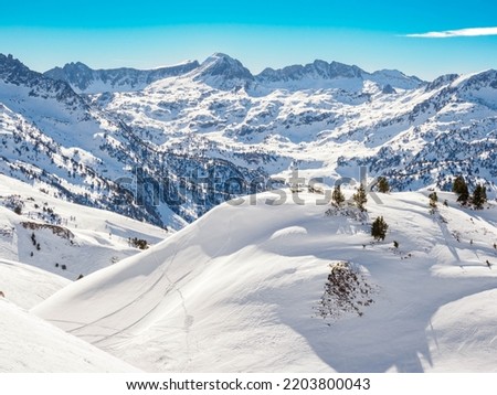 Mountain range with snowcapped peaks in Baqueira ski fields,  Catalonia pyrenees