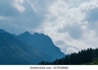 Mountain range under clouds. Rocks for Hiking and tourism