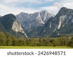 The Gesäuse mountain range and view into the Enns valley and the Hochtor massif. The Gesaeuse range is part of the Ennstal Alps and a national park in Styria, Austria 