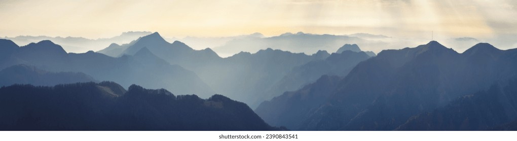 Mountain range with visible silhouettes through the morning fog. Traveling along the mountains, freedom and active lifestyle concept. Vibrant photo wallpape. Natural background. Panorama  Carpathian - Powered by Shutterstock