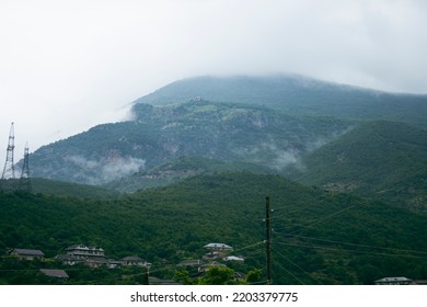 Mountain ranges covered with forest under the clouds - Powered by Shutterstock