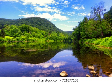 Mountain reflection in Housatonic River in West Cornwall, Connecticut united states.