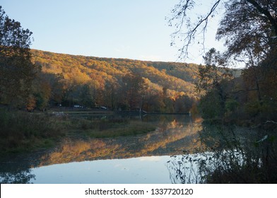 A Mountain Reflection Off A Lake In Devil's Den State Park In Arkansas.