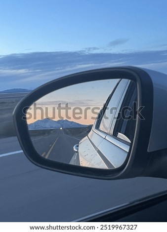 Mountain reflection in rearview mirror