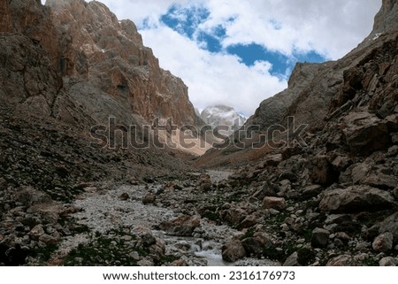Mountain river between rock peaks