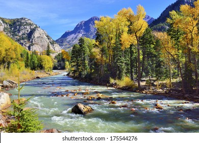 mountain river and colourful mountains of Colorado during foliage season - Powered by Shutterstock