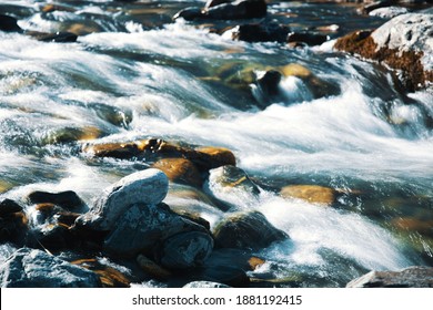 Mountain river flow through rocks and stones long exposure picture at Davos Switzerland
