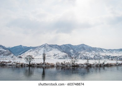 mountain and river in snow 
