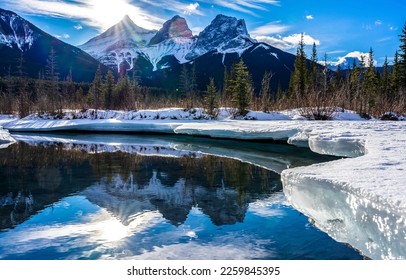 Mountain river in a snowy forest in winter. River water reflection in winter mountains. Snow river in mountains. Winter mountain river in snow - Powered by Shutterstock