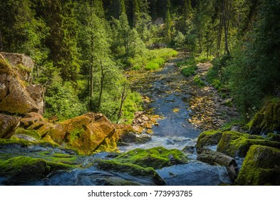 mountain river, view from waterfall top - Shutterstock ID 773993785