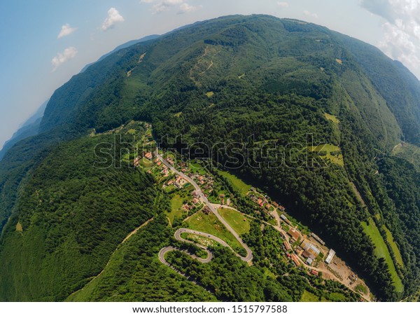 Mountain road aerial view. The Romanian\
Carpathians, 2019. Little\
planet