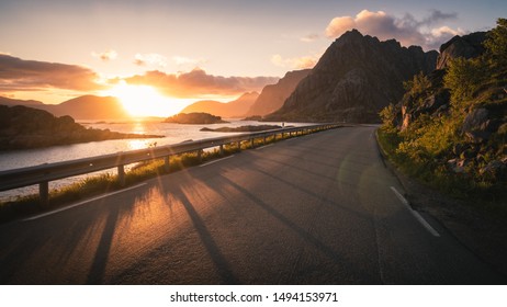 Mountain road at beautiful sunset in Lofoten Islands, Norway - Powered by Shutterstock