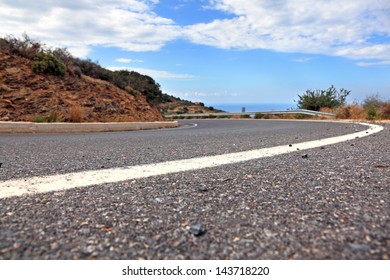 Mountain Road In Crete, Greece. Low Angle View. Shallow DOF.