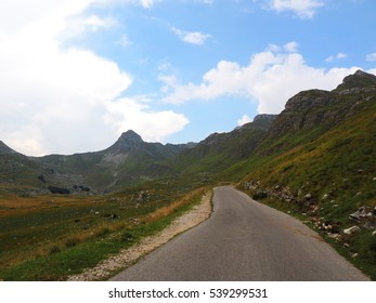 mountain road under the cloudy sky